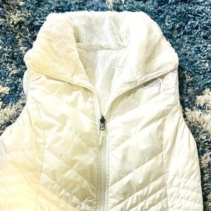 Excellent condition NF women’s reversible vest size medium